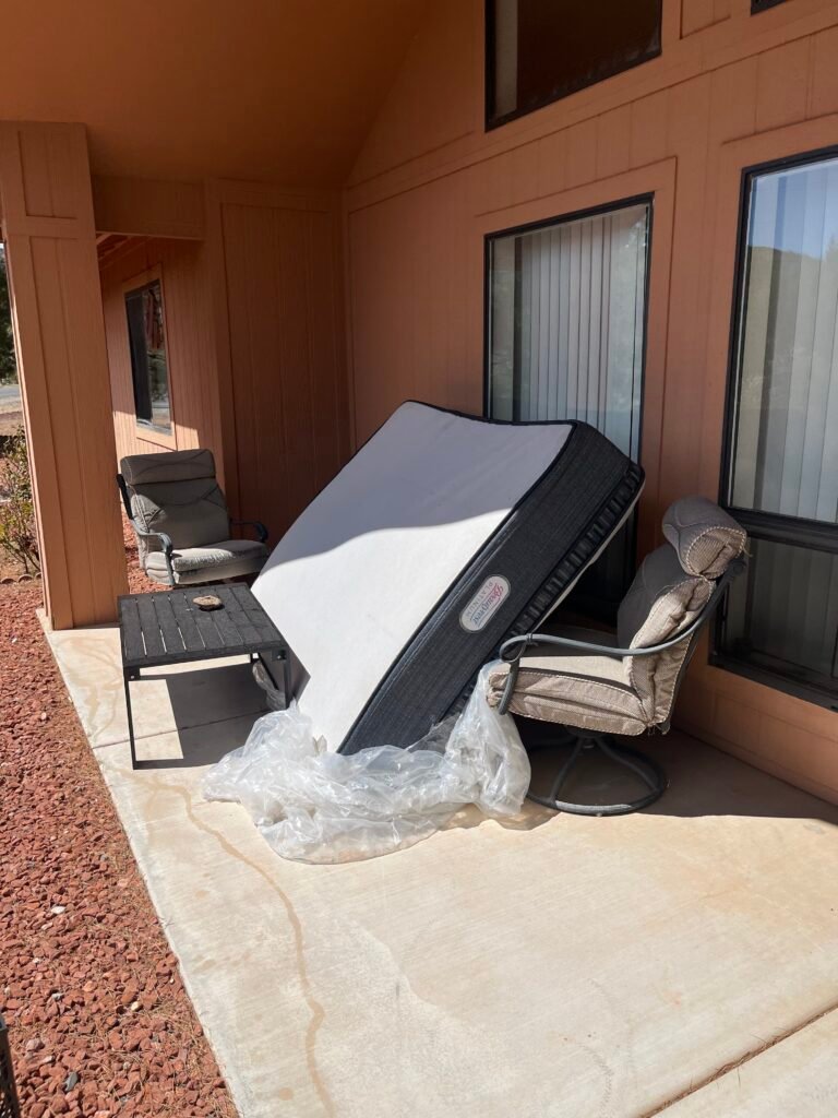 Couch removal in Flagstaff: old couch staged for pickup